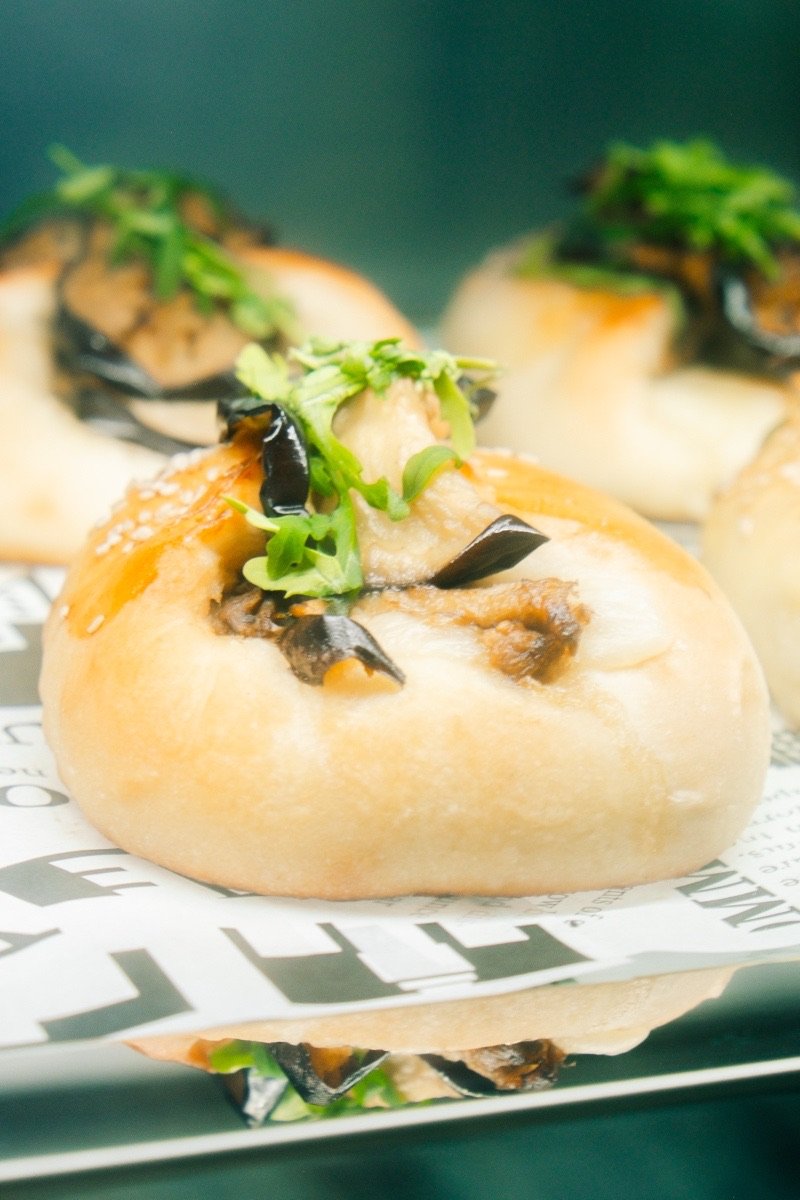 Freshly baked Italian buns topped with grilled aubergine and rocket at Inglima Paceville