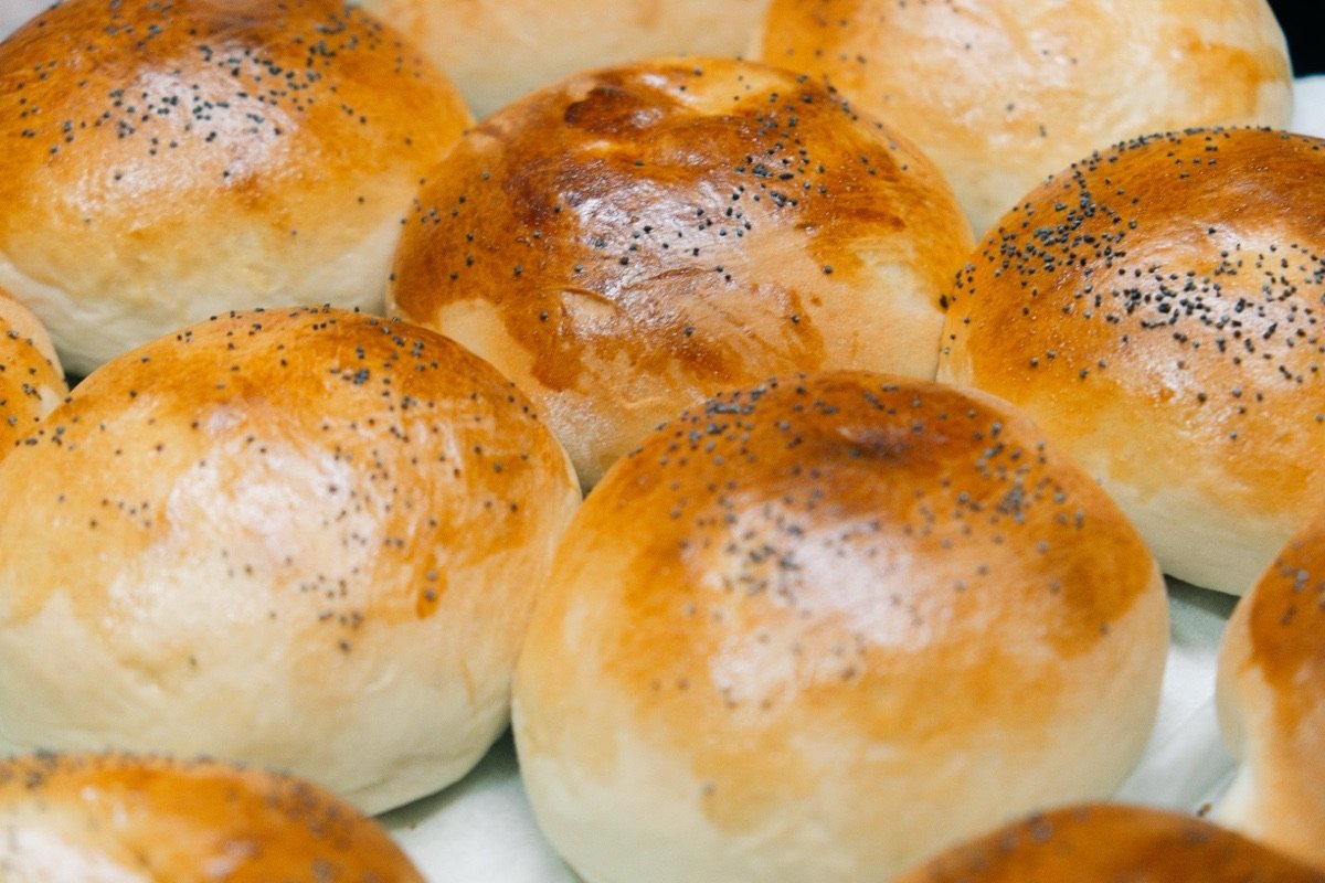 Freshly baked golden poppy-seed brioche buns